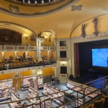 Interior of Giunti Odeon cinema bookstore in Florence showing 1920s Art Nouveau architecture and theater seating