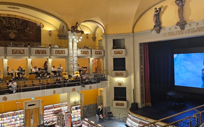 Interior of Giunti Odeon cinema bookstore in Florence showing 1920s Art Nouveau architecture and theater seating