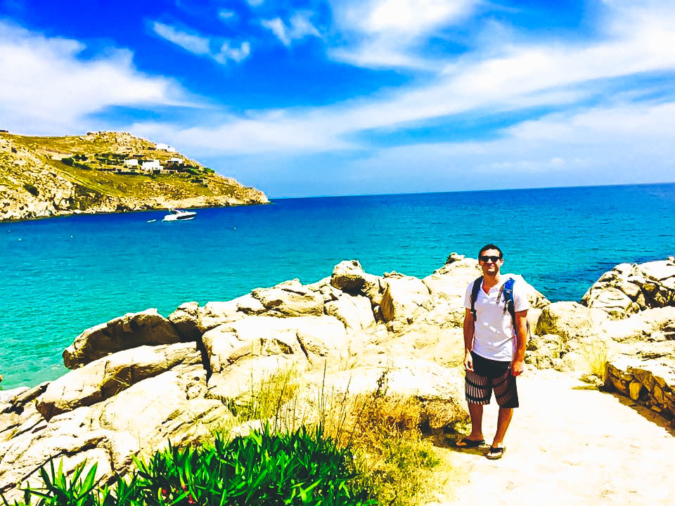 Travel Guide to Mykonos_What to do_Where to Stay_Mykonos Island_Greece_3 day itinerary_blog_Paradise BEach_hike from Paranga_Boy_Ocean_cliff view_party island