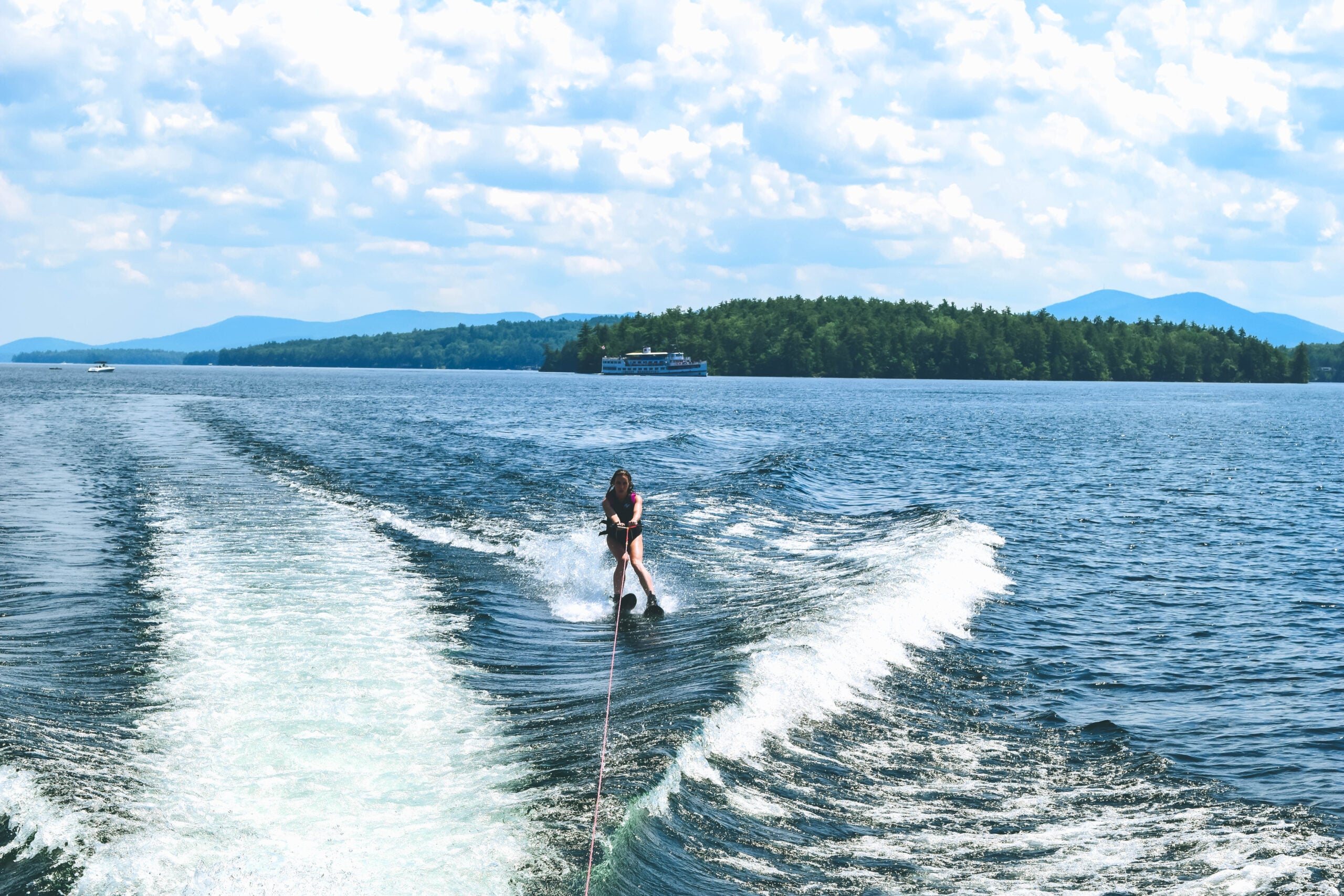 Lake Winnipesaukee_New Hampshire_Travel Guide_What to do_What to See_nature_waterskii_sport_athletic_girl_adventure