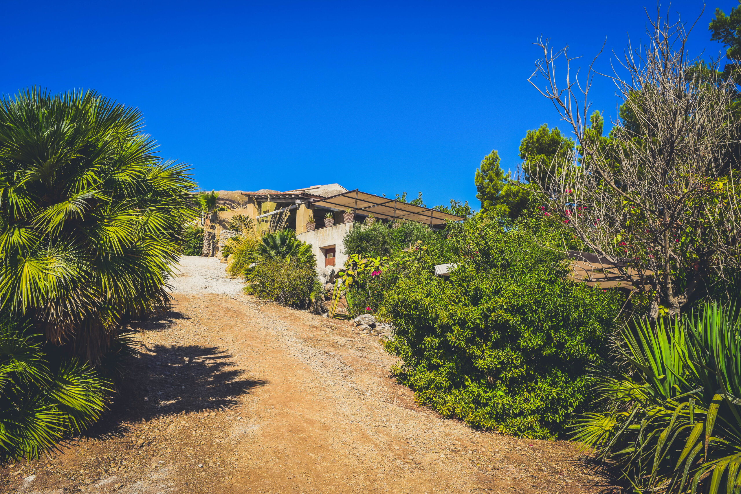 baglio from below Hotel Baglio La Porta Sicilia near San Vito Lo Capo Riserva dello Zingaro Private exclusive resort cliffs best of sicily sicilia hidden gem off the beaten path luxury